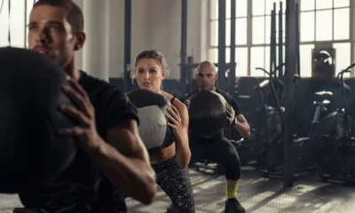 Fitness trainer learning first aid to ensure client safety in gym