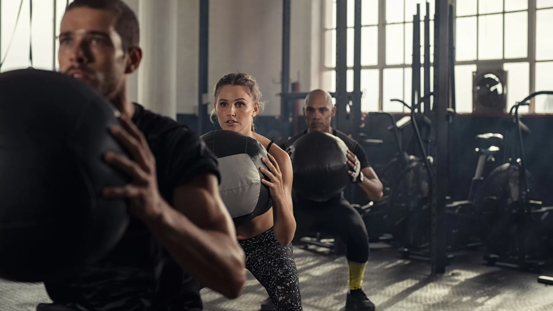 Fitness trainer learning first aid to ensure client safety in gym